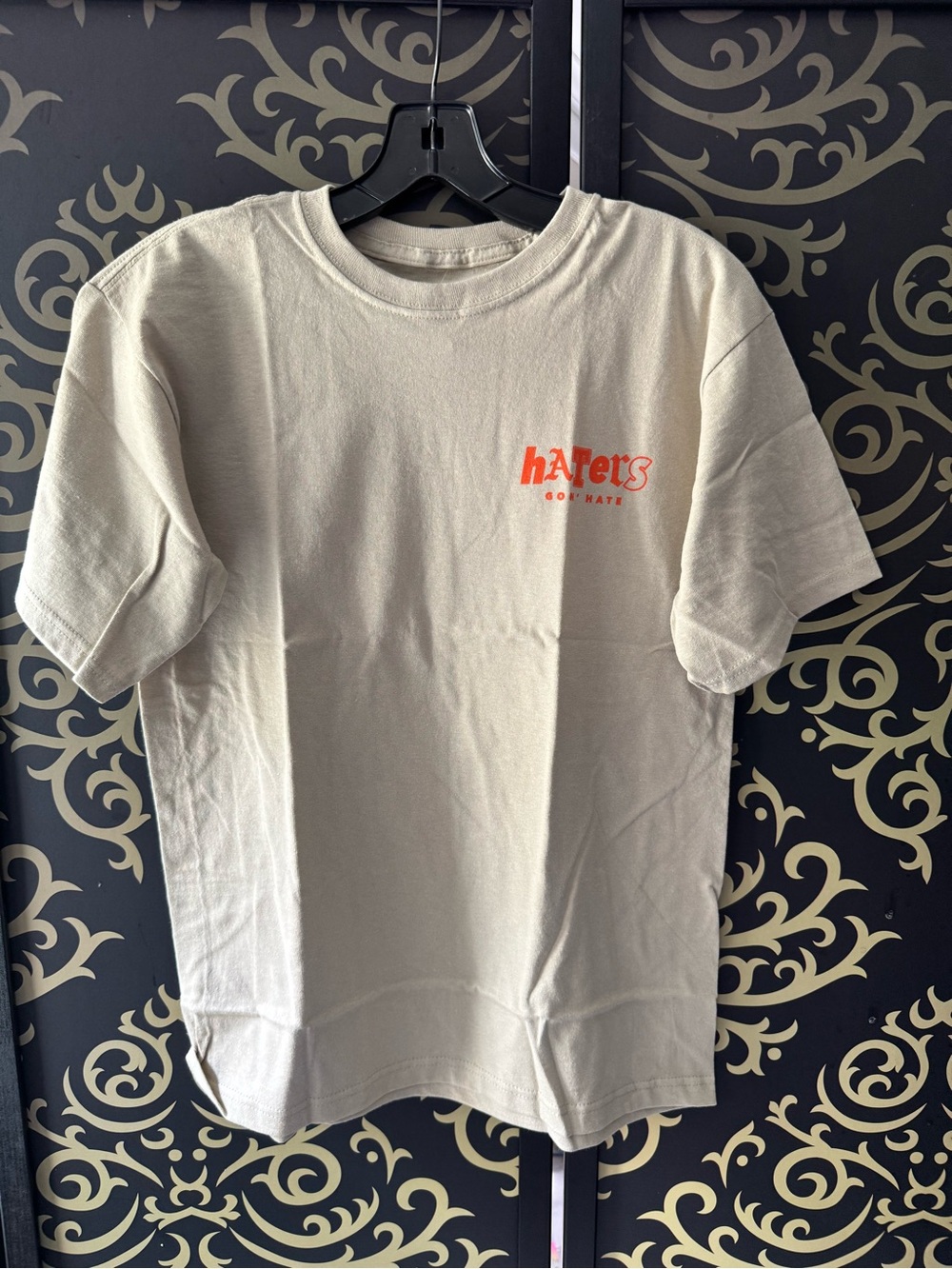 Fashion Nova Kids Cream Crewneck Tee with Orange 'Haters' Chest Logo